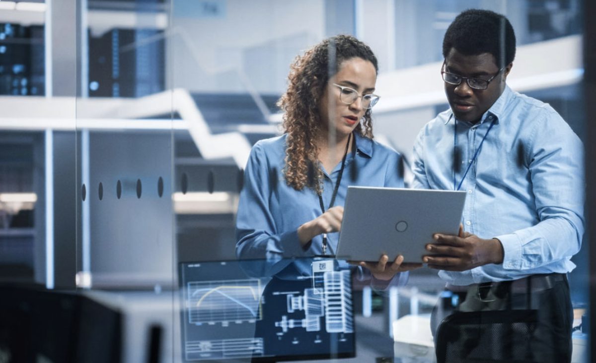 MP.IT consultants reviewing an industry system